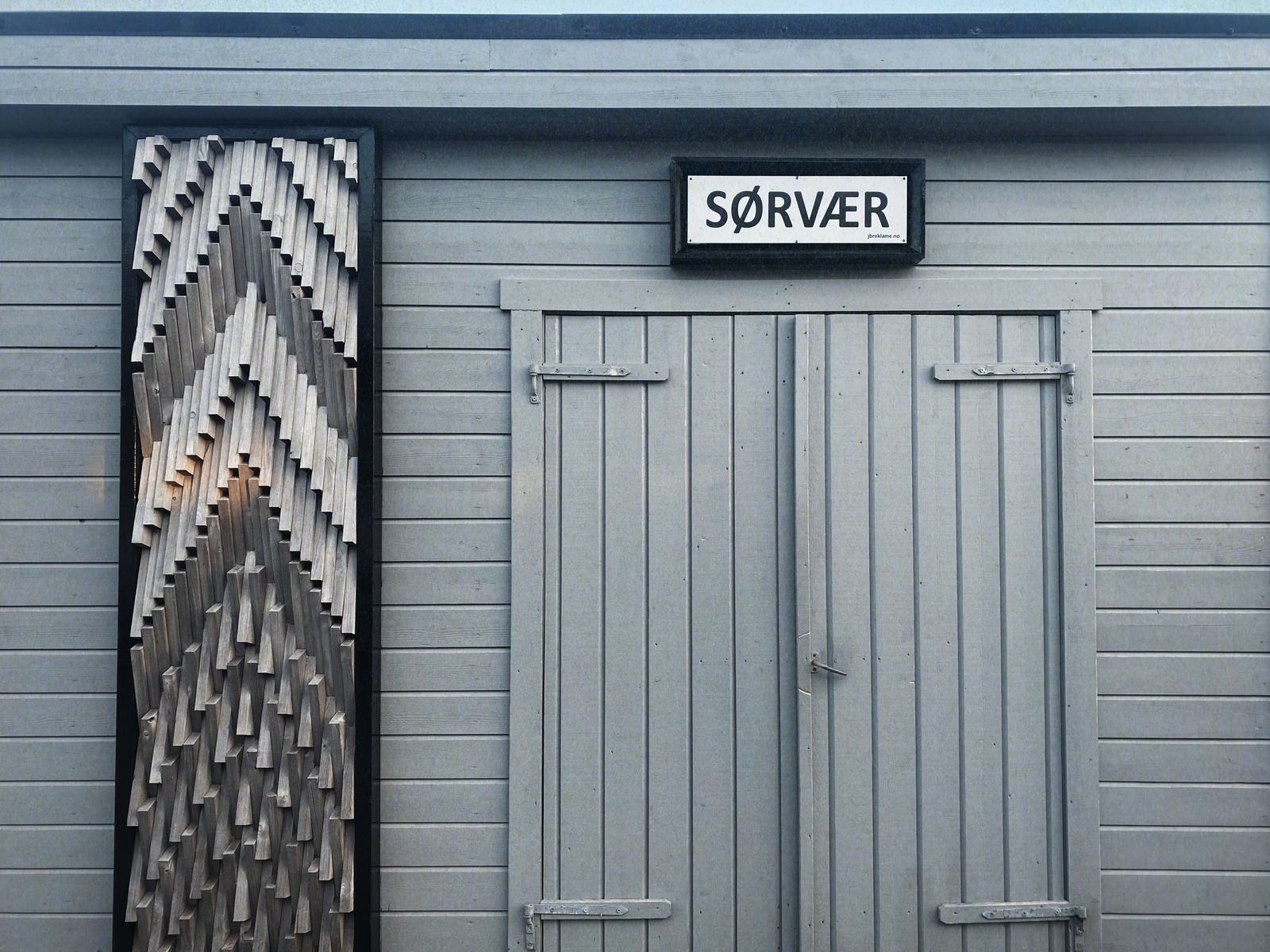 The Sørvær sign on the ferry waiting room