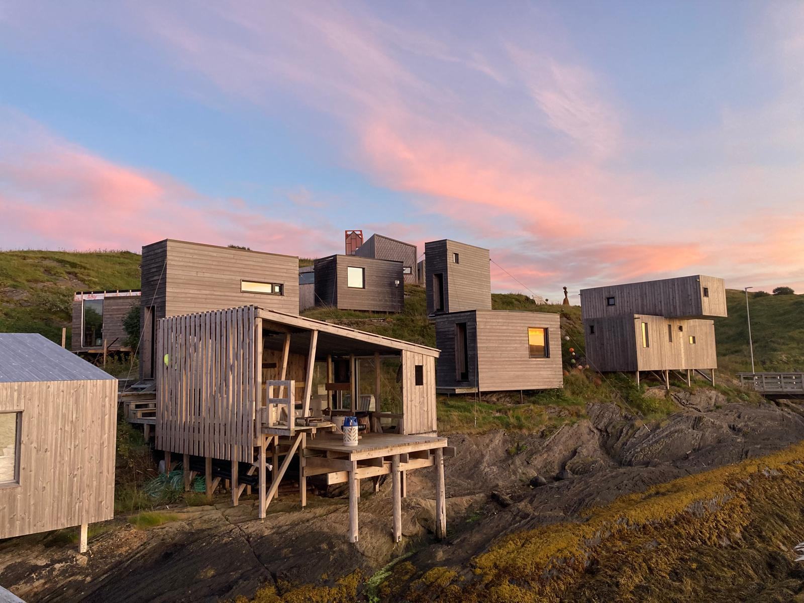 The cabins on the rocks in warm evening light