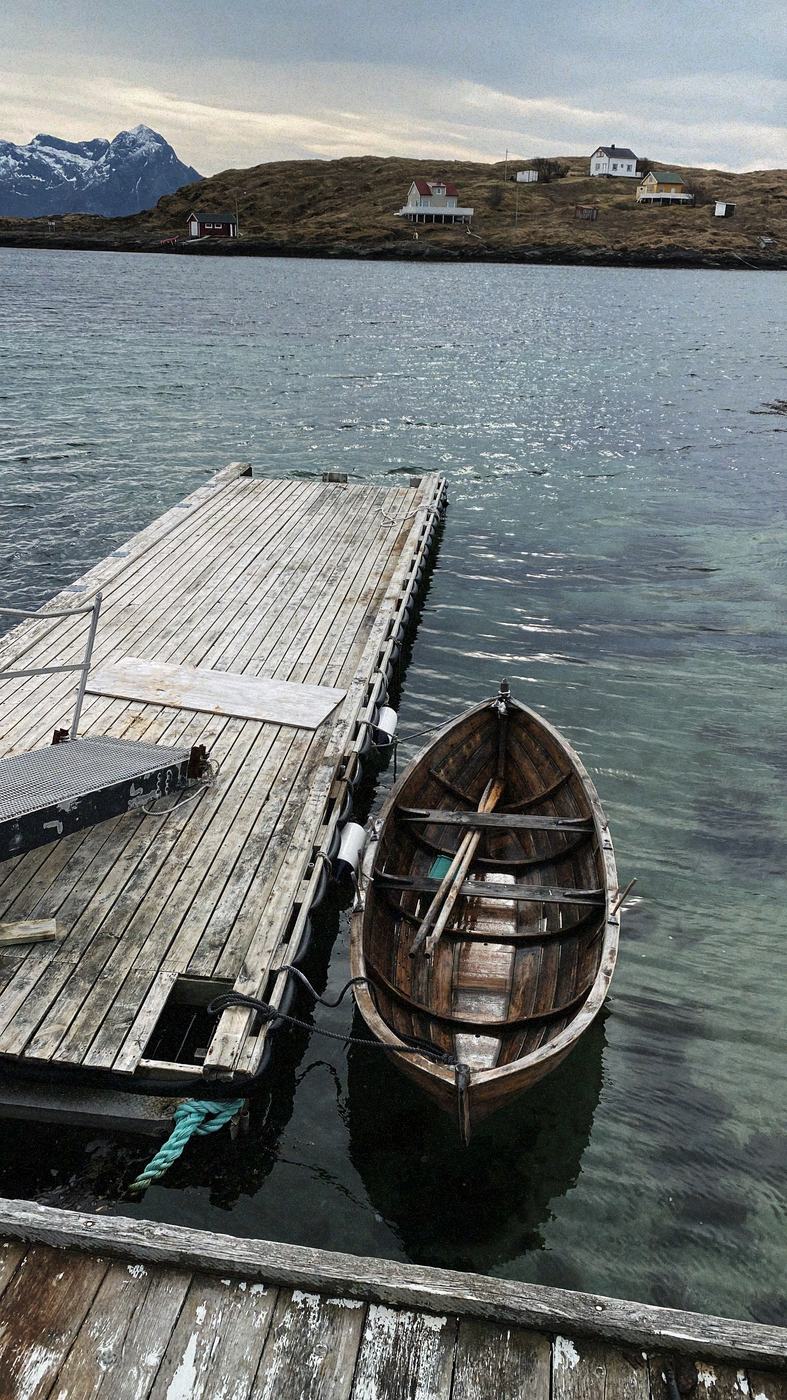 Håvard's wooden boat moored at the pier